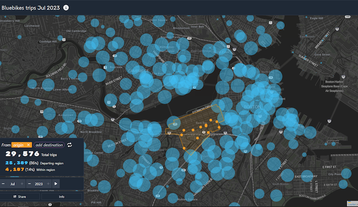 A screenshot from Patrick Cleary's Bluebikes data exploration, showing circles expanding in size for popular starts for Bluebike trips in Boston. Many are centered around South Cambridge and Downtown Boston.